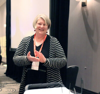 Marie smiles into the camera.