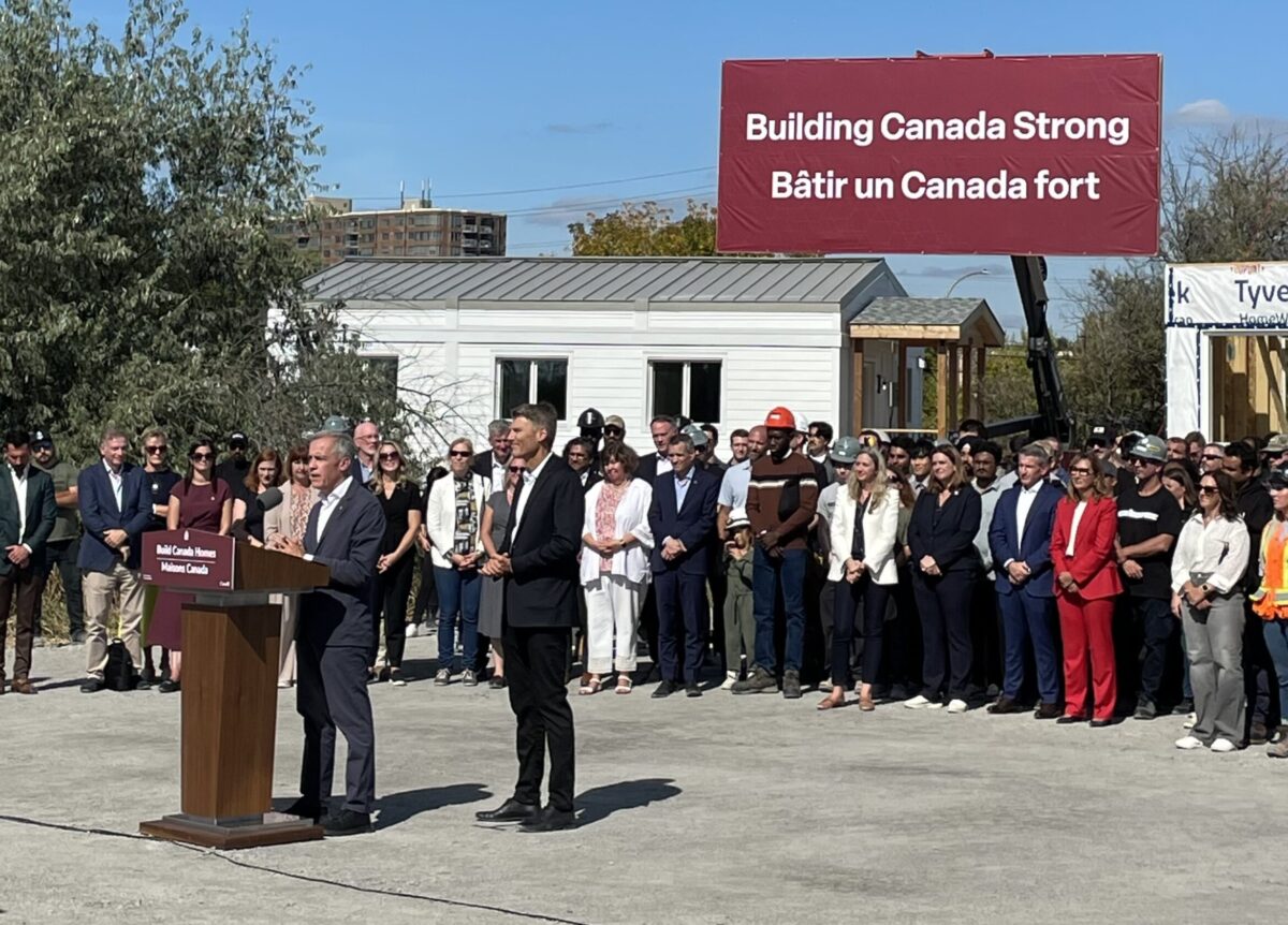 Prime Minister Mark Carney and Housing Minister Gregor Robertson at the launch of Build Canada Homes